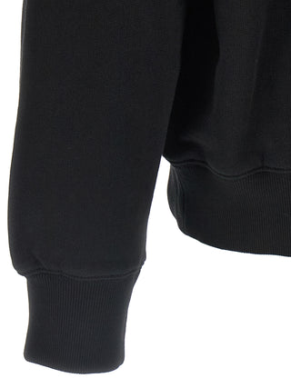 Black Carhartt Wip cotton sweatshirt with ribbed cuffs and crew neckline, displayed on a hanger.