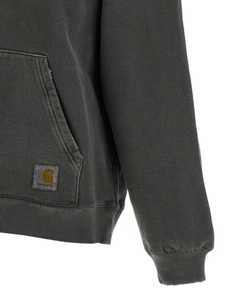 Black Carhartt Wip cotton sweatshirt with ribbed cuffs and crew neckline, displayed on a hanger.