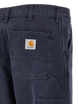 Blue organic cotton casual pants by Carhartt Wip featuring a relaxed fit and classic design.
