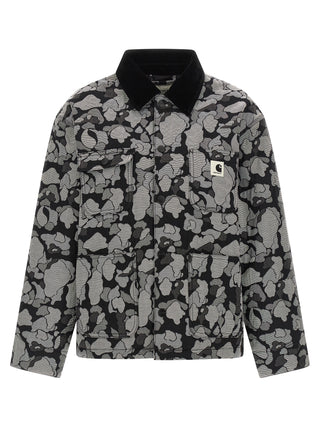 Gray Carhartt Wip cotton full-length jacket hanging on a rack with visible zipper and pockets.