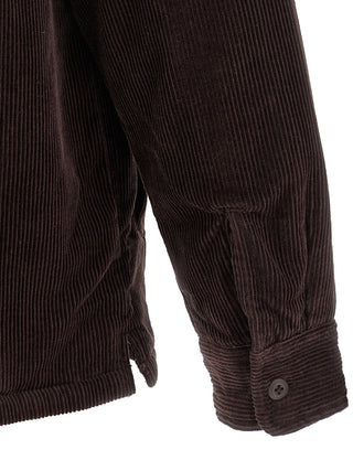 Carhartt Wip brown cotton jacket with front pockets and button closure, styled on a hanger.