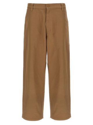 Beige Carhartt Wip cotton casual pants with relaxed fit and functional pockets, shown on a model.