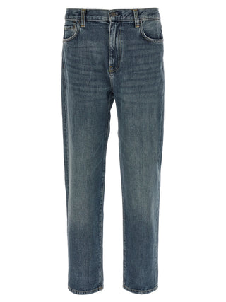 Blue Carhartt Wip cotton tapered jeans with classic five-pocket design and relaxed fit, shown on a model.