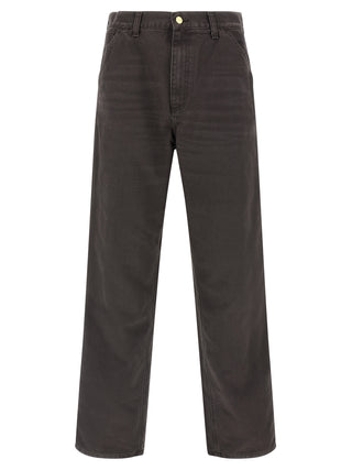 Brown organic cotton casual pants by Carhartt Wip, featuring a relaxed fit and classic design with pockets and belt loops.
