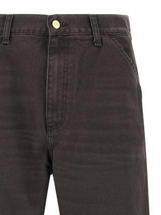 Brown organic cotton casual pants by Carhartt Wip, showing relaxed fit and classic design on a neutral background.