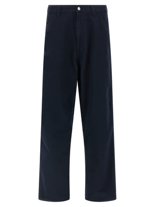 Blue organic cotton casual pants by Carhartt Wip, featuring a relaxed fit and classic design, displayed on a model.