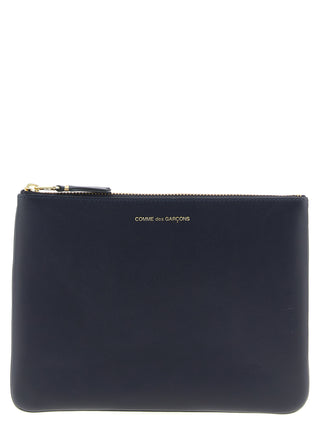 Blue cowhide cardholder by Comme Des Garçons with multiple card slots and minimalist design.