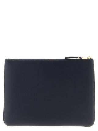 Blue cowhide cardholder by Comme Des Garçons featuring multiple card slots and sleek design.