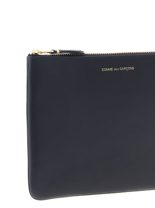 Blue cowhide cardholder by Comme Des Garçons with multiple card slots and sleek design, shown in image 11202138.