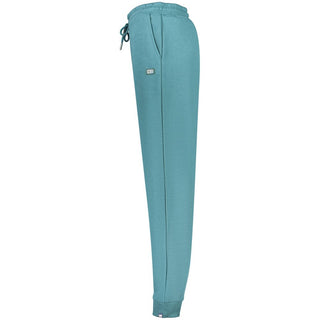 Green cotton women's trousers from Norway 1963, featuring a relaxed fit and stylish design, shown on a model.