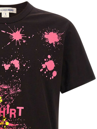 Black cotton T-shirt by Comme Des Garçons, showcasing a simple crew neck design and soft fabric for casual wear.