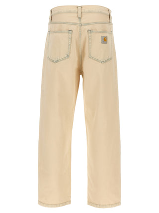 Beige Carhartt Wip cotton straight-leg jeans shown flat with front pockets and classic stitching.
