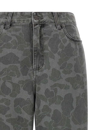 Gray Carhartt Wip organic cotton tapered jeans laid flat showing front and back details.