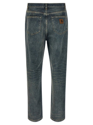 Gray Carhartt Wip cotton straight-leg jeans shown on a hanger, highlighting classic denim style and durable fabric.