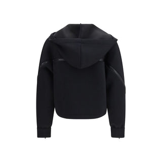 Black polyester sweatshirt by Wolford with a relaxed fit and ribbed cuffs, shown on a plain background.