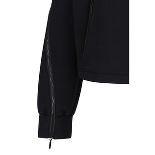 Black Wolford polyester sweatshirt with a relaxed fit, featuring a crew neckline and long sleeves, displayed on a flat surface.