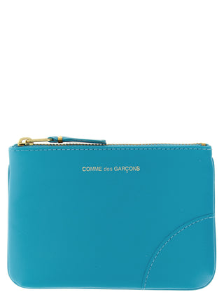 Blue calfskin cardholder by Comme Des Garçons featuring a sleek, minimalist design with multiple card slots and smooth leather finish.