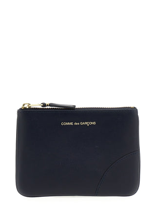 Blue calfskin cardholder from Comme Des Garçons with multiple card slots and a sleek, minimalist design.