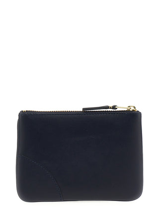 Blue calfskin cardholder by Comme Des Garçons with multiple card slots and sleek design.