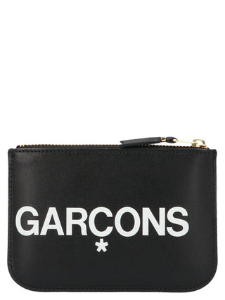 Bicolor calfskin cardholder by Comme Des Garçons with multiple card slots and sleek design on a white background.