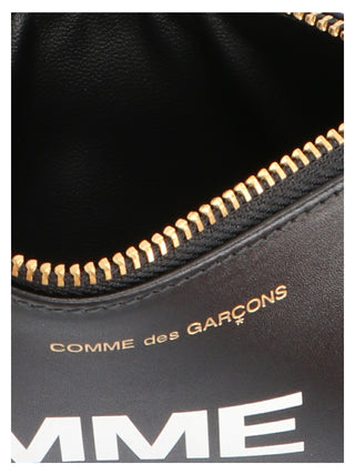 Bicolor calfskin cardholder by Comme Des Garçons showing sleek design with multiple card slots and smooth leather texture.