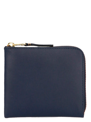 Blue calfskin wallet by Comme Des Garçons with sleek design, featuring multiple card slots and a minimalist style.