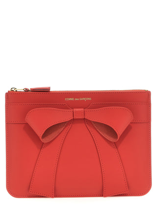 Red cowhide cardholder from Comme Des Garçons with multiple card slots and sleek leather design.