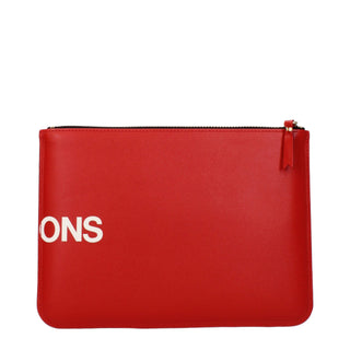 Red leather clutch bag by Comme Des Garçons with a sleek, minimalist design and clean stitching.