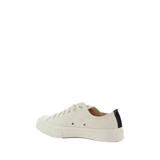 White cotton low top sneakers from Comme Des Garçons Play x Converse featuring classic design and rubber soles.