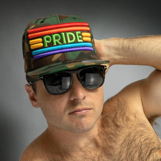 Dark Yarn Pride Camo Snapback hat with a colorful camouflage pattern and structured brim, showcasing a stylish headwear design.