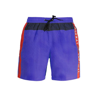 Blue polyester men's swim trunks by Norway 1963 with an elastic waistband and side pockets, suitable for swimming and beachwear.