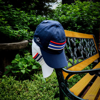 Dark Yarn Nautilus Reserve Dockside Cap, a stylish headwear with a nautical design, featuring adjustable strap and branded logo.